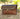 Handmade bamboo rattan weave ladies handbag with vintage brass lock on natural background.