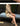Women's fashion hollow bamboo handbag shoulder bag worn with a beige outfit.